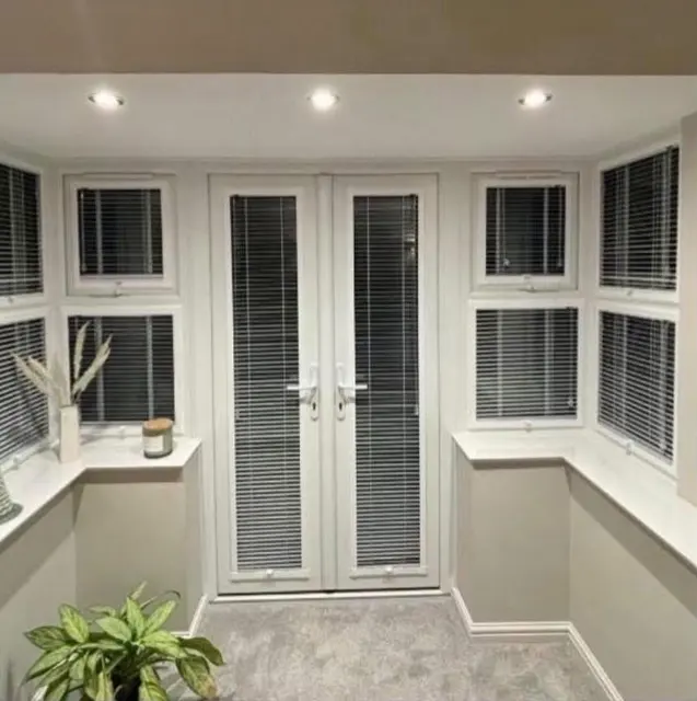 Venetian blinds in a conservatory — genuine completed work by Gemini Blinds