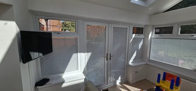 Venetian blinds in a conservatory — genuine completed work by Gemini Blinds